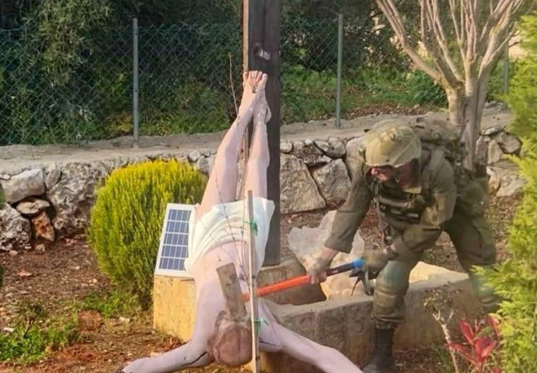 Outrage after photo captures Israeli soldier destroying Jesus statue in Lebanon
